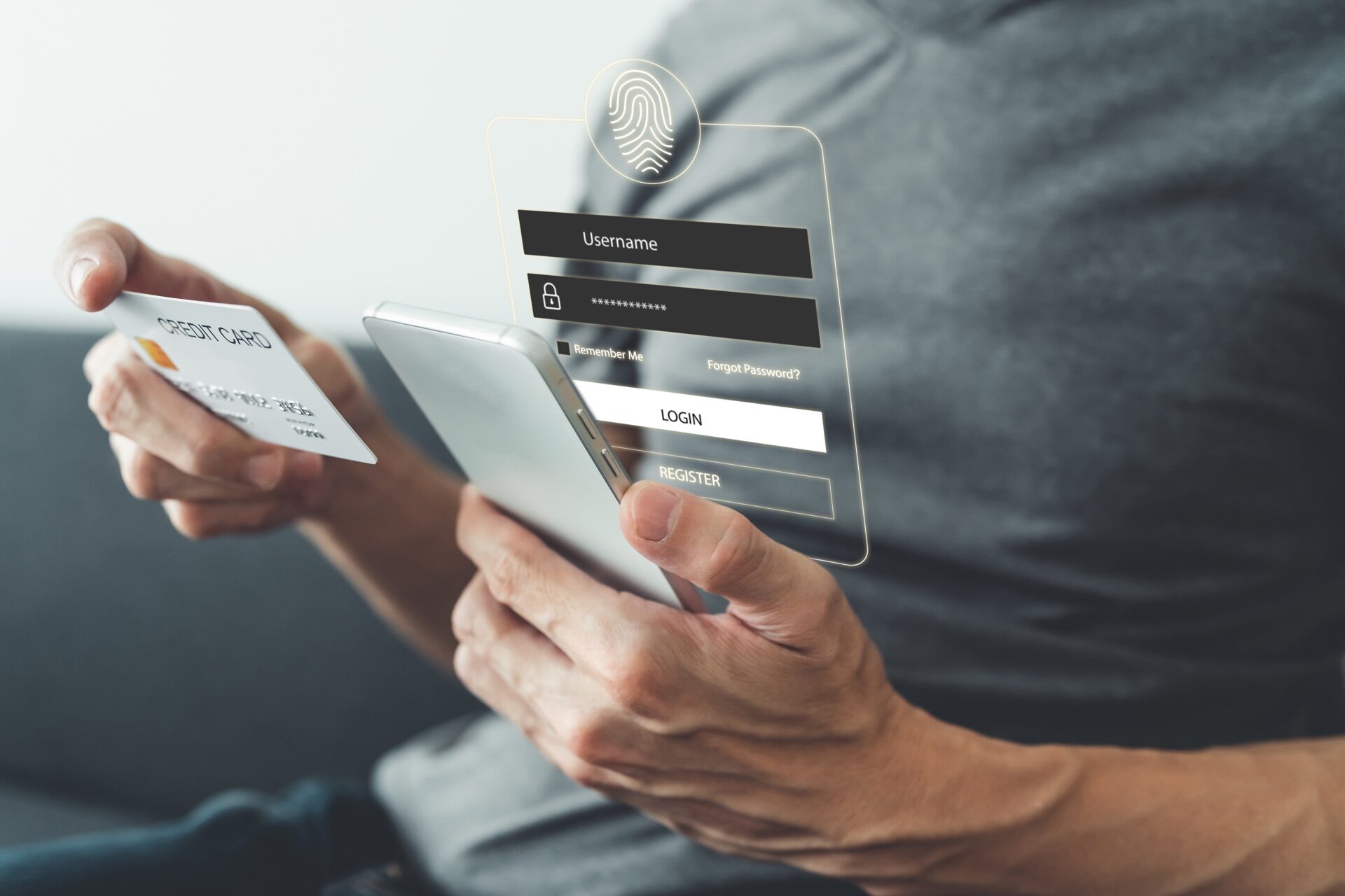 Kaltenbach Gruppe – Eine Person, die eine Kreditkarte und ein Smartphone in der Hand hält, mit einem virtuellen Anmeldebildschirm, der die Felder für den Benutzernamen, das Passwort und das Fingerabdrucksymbol anzeigt - ideal für Geschäftskunden, die Online-Zahlungen oder Bankgeschäfte sicher abwickeln. – BMW, MINI, KIA, BMW Motorrad & Honda Motorrad Partner in NRW